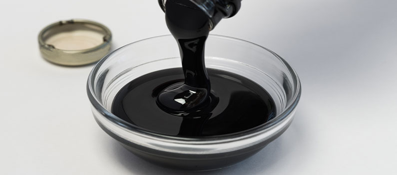unsulfured molasses for plants pouring unsulfured molasses for plants in glass bowl